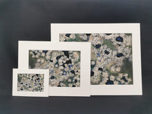 Load image into Gallery viewer, An A4 print of Snowy Pine Trees seen from Above with a 16"x12" mount